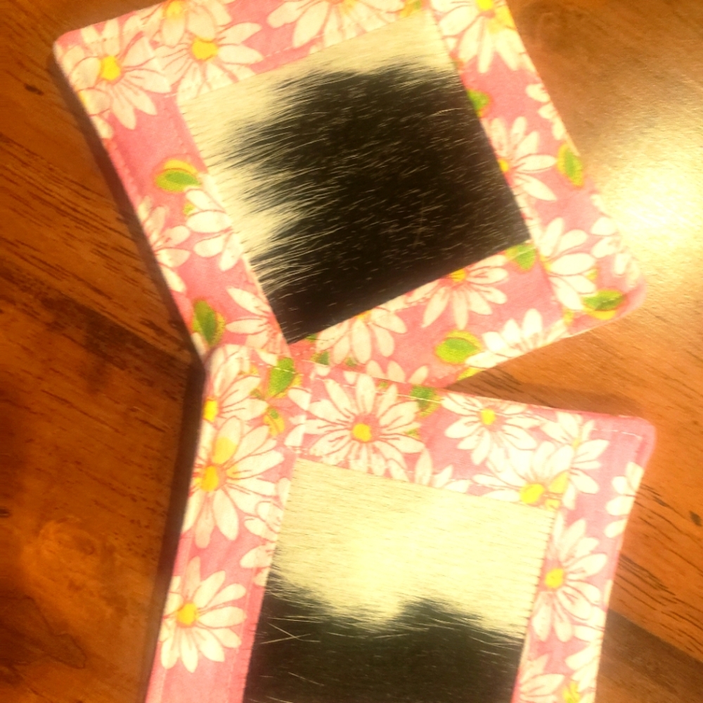 Black and white cowhide mugrugs